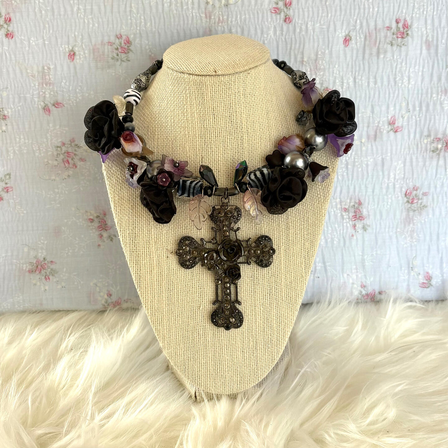 much like its namesake, this necklace is no short of a masterpiece. featuring glass statement beads, oversized glass pearls, glass + acrylic flowers, fabric roses, swarovski charms, a vintage pendant centrepiece, and stainless steel hardware.